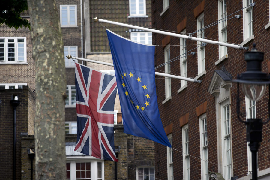 A European, right, and Union flags are displayed outside Europe House, the European Parliaments British offices, in London, Wednesday, June 22, 2016. Britain votes whether to stay in the European Union in a referendum on Thursday. (AP Photo/Matt Dunham)