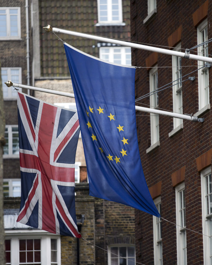A European, right, and Union flags are displayed outside Europe House, the European Parliaments British offices, in London, Wednesday, June 22, 2016. Britain votes whether to stay in the European Union in a referendum on Thursday. (AP Photo/Matt Dunham)