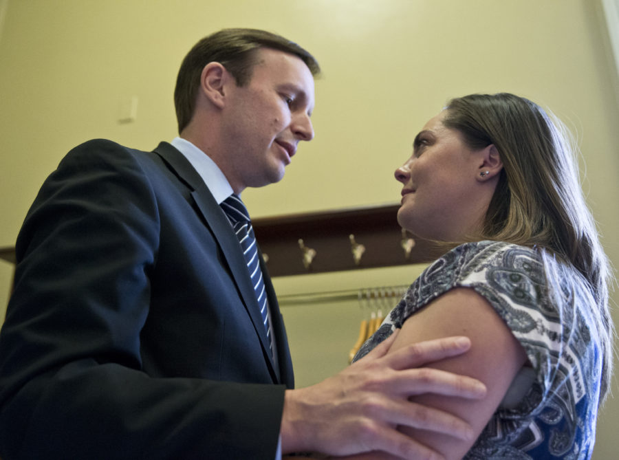 Sen. Chris Murphy, D-Conn., left, comforts Erica Smegielski, daughter of the slain principal from Sandy Hook Elementary School Dawn Hochsprung, Monday, June 20, 2016, on Capitol Hill in Washington. A divided Senate blocked rival election-year plans to curb guns, eight days after the horror of Orlandos mass shooting intensified pressure on lawmakers to act but knotted them in gridlock anyway - even over restricting firearms for terrorists. (AP Photo/Alex Brandon)