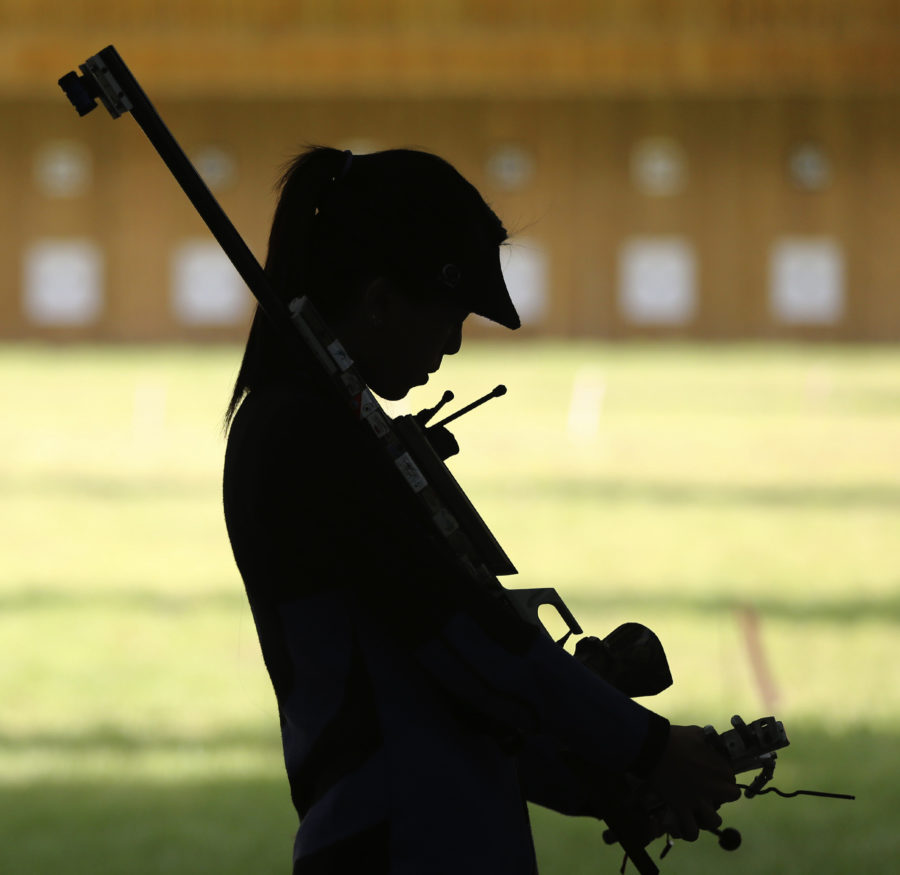 Singapores Cheng Jian Huan prepares her rifle to leave from the shooting range after a practice session at the Womens 50m Rifle Prone Individual competition at the 17th Asian Games Tuesday, Sept. 23, 2014 in Incheon, South Korea. (AP Photo/Eugene Hoshiko)